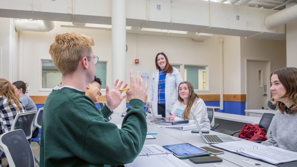 Professor Kara Cucinotta talks to students during a working session to assess a new patient’s dietary needs.