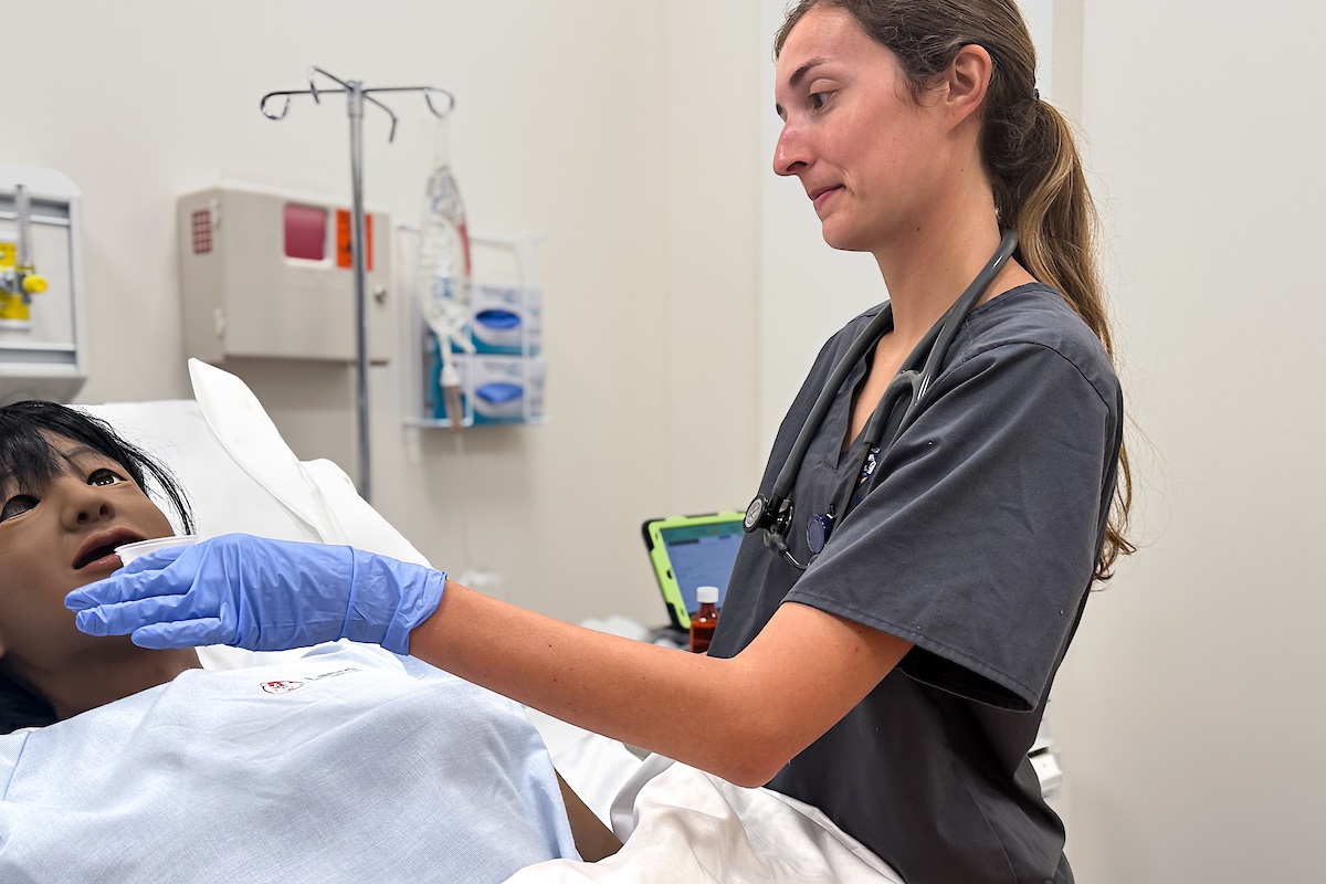 female nursing student in lab