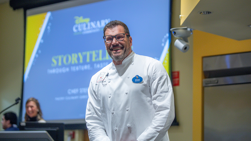 Walt Disney World Pastry Culinary Director Stefan Riemer speaking to a group during his Designing Flavor and Education at Disney panel.