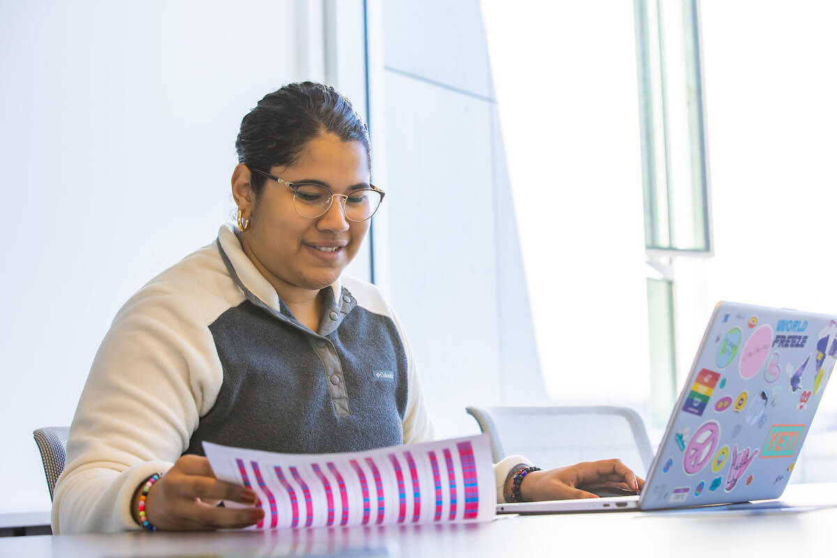 female college student using laptop