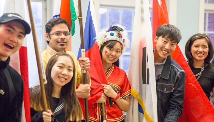 Students standing with flags