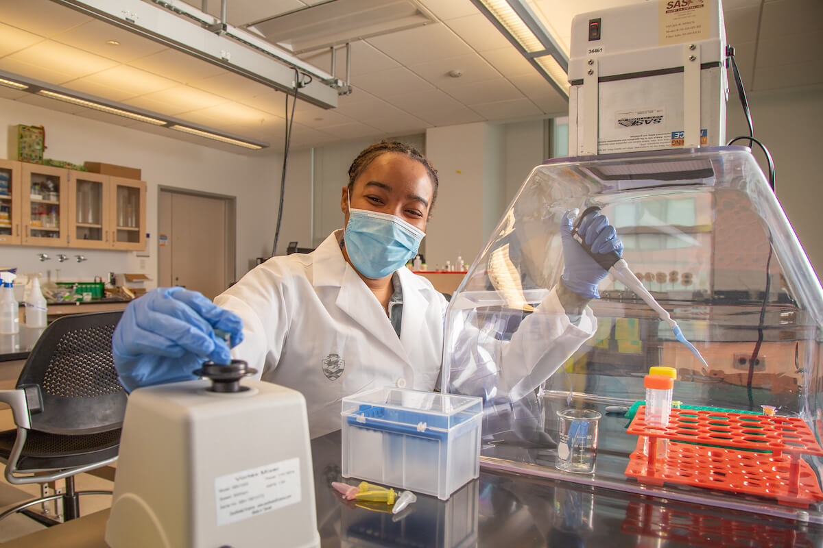 female biology student working in lab