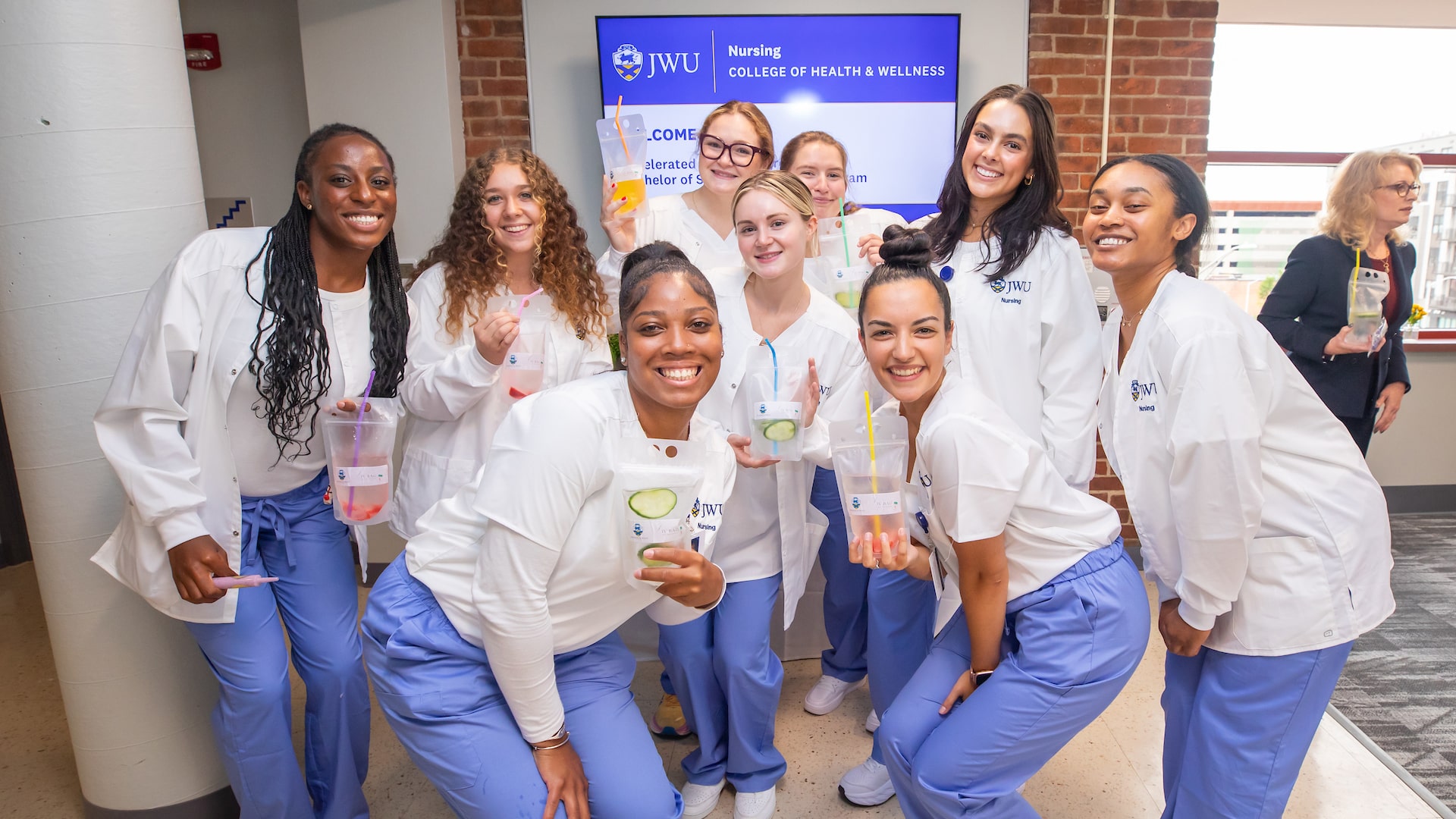 Students from the new Nursing cohort welcome visitors to the new facility.