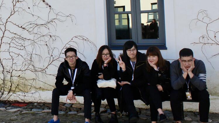 JWU students take a sit down break in Lisbon.