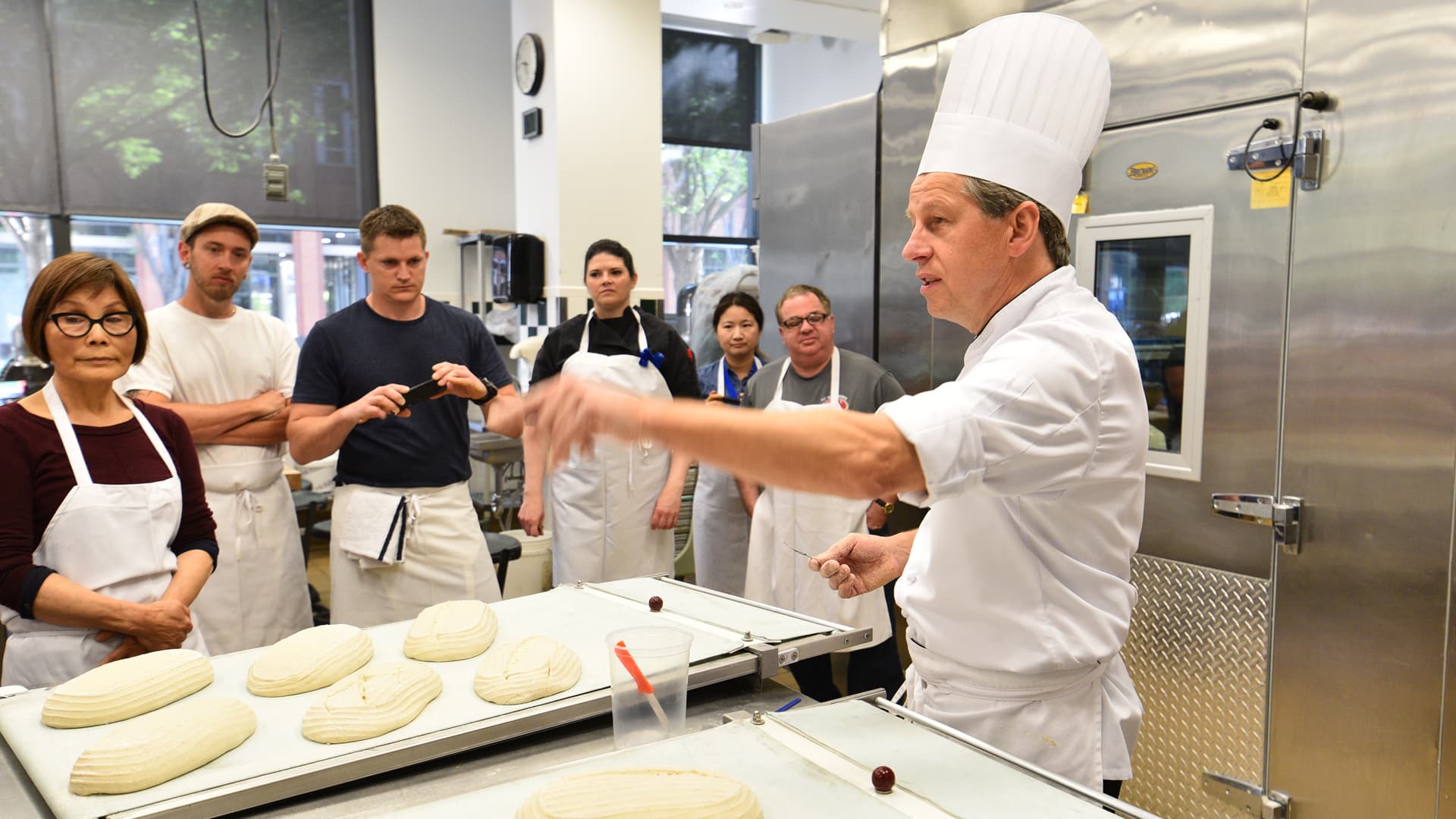 Harry Peemoeller of JWU Charlotte leads a bread demo.