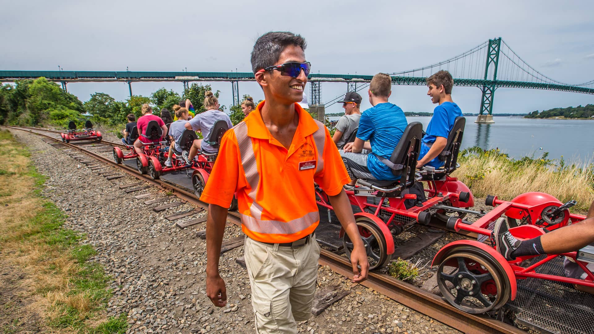 Tour group getting ready to ride the rails under the Pell Newport Bridge.