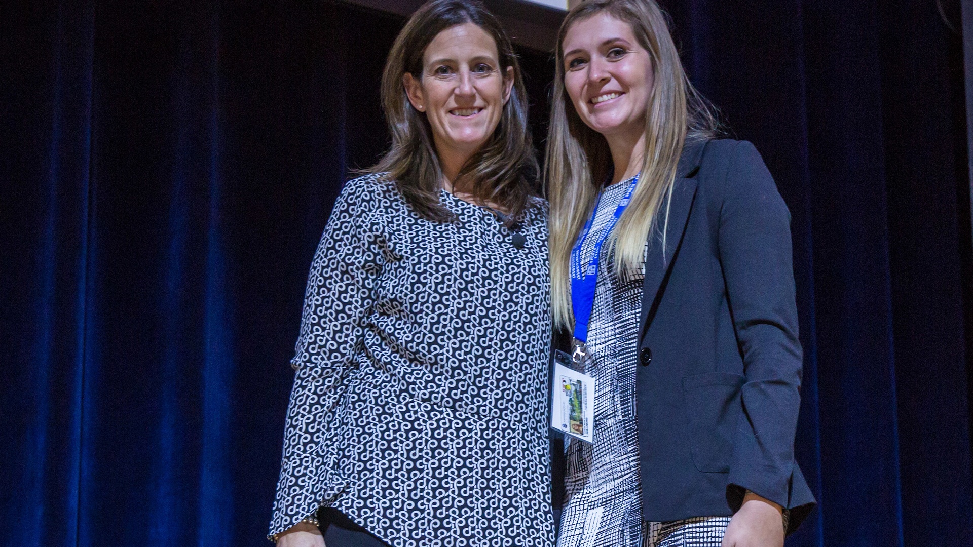 Student Aralyse Johnson with speaker  Jennifer Ferron, vice president of marketing & brand development,  Kraft Sports & Entertainment Group with student 