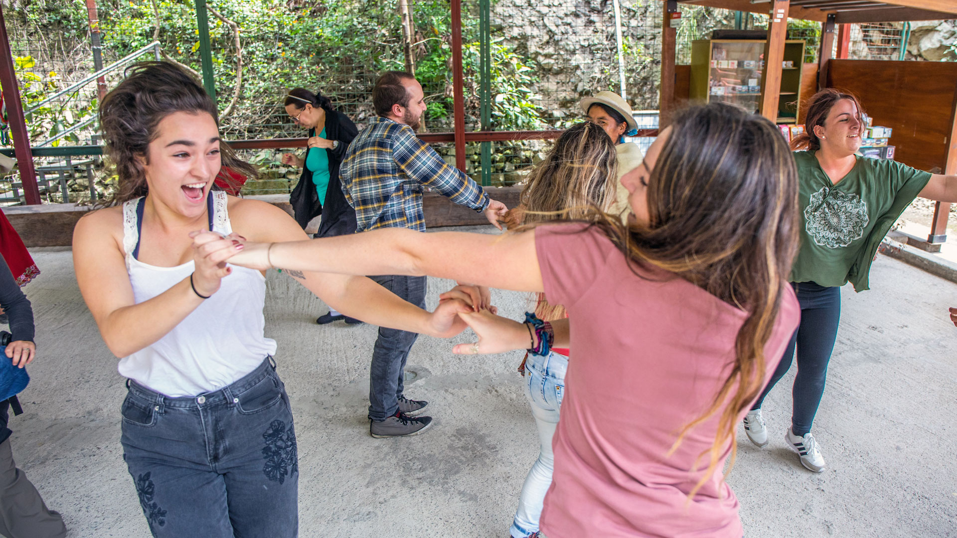 Dancing to Ecuadorian music are Katie Horrigan (left, front), Nicole Pontari, Chris Comstock and Rachel Saffell