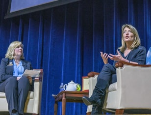 Cindi Bigelow '19 Hon. speaking to JWU students in 2019.