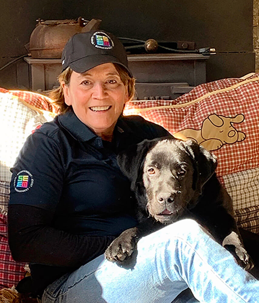 Brenda Eckler with her dog at home.