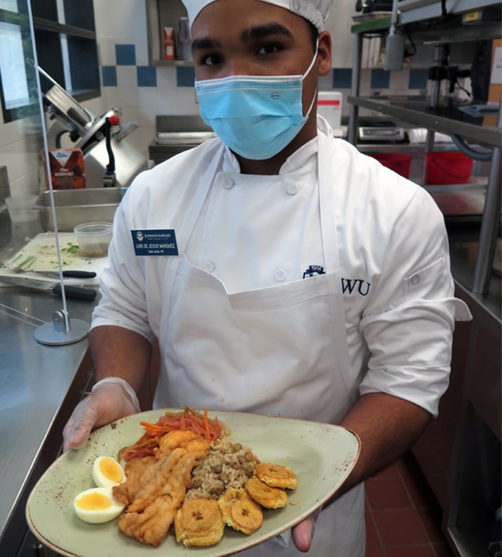 Marquez shows off his escabeche, mofongo and tostones platter.