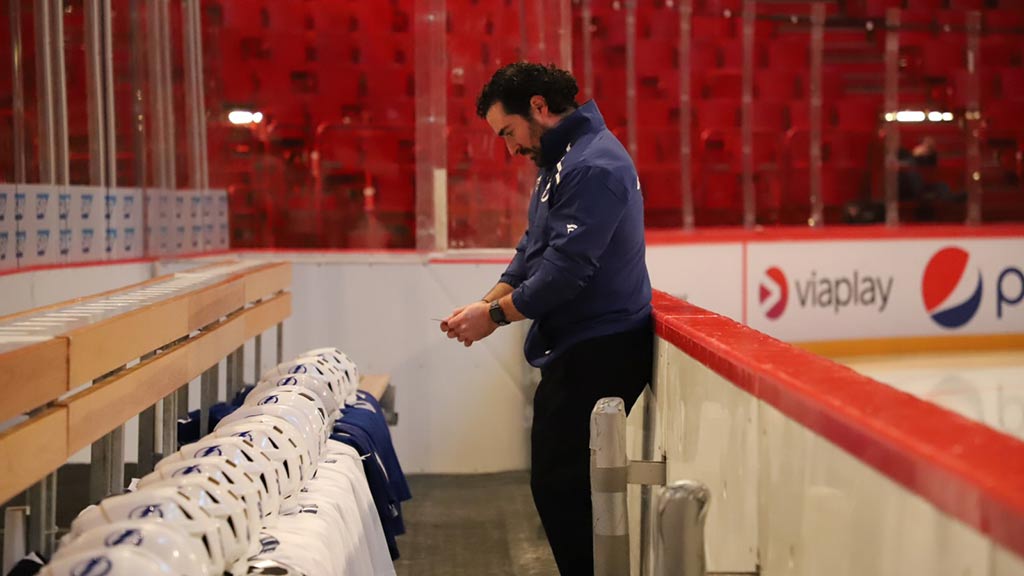 Jason Berger preparing the Tampa Bay bench before a game