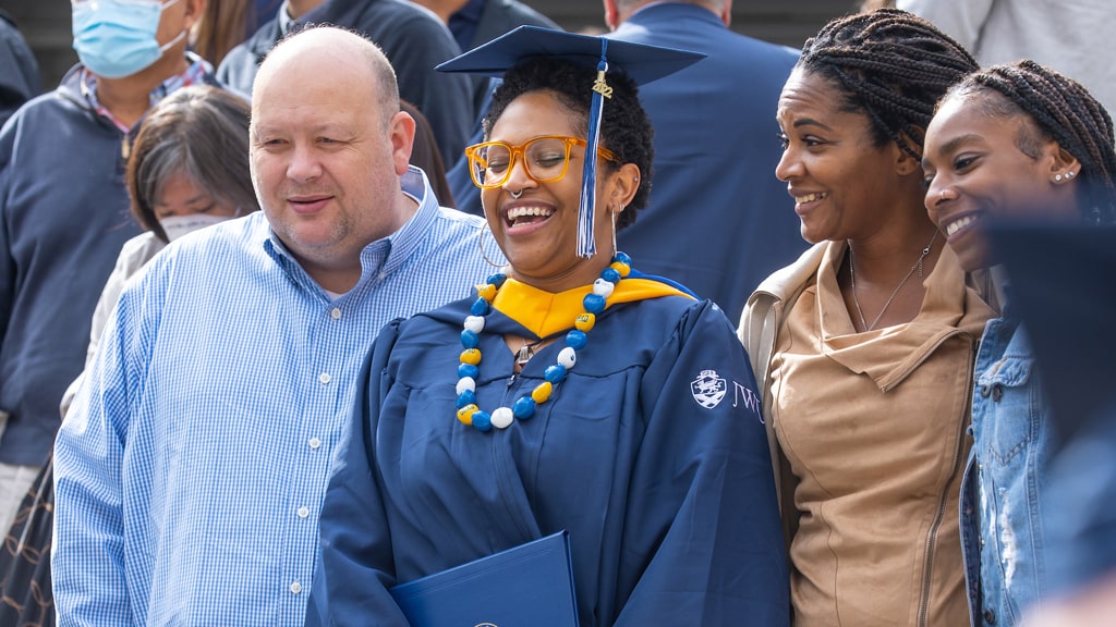 Family portrait with JWU bling (mortarboard and matching necklace in JWU colors).