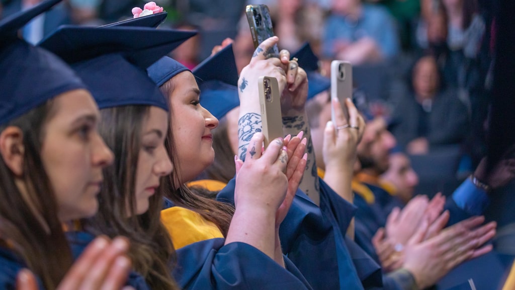 Taking iPhone photos at graduate Commencement.