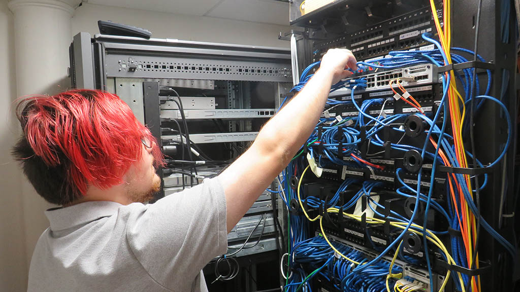 Student working in a server room