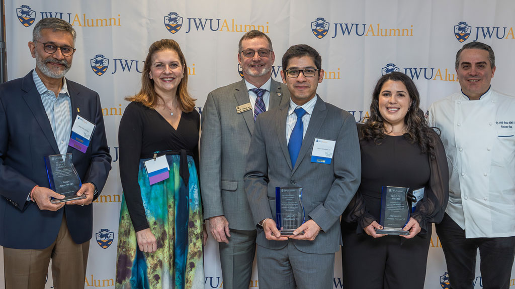 a group photo of the 2024 Distinguished Alumni Awards recipients and presenters