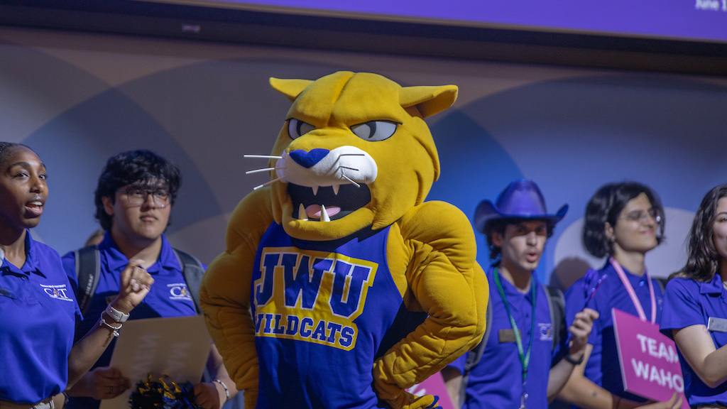 Providence orientation mascot on stage