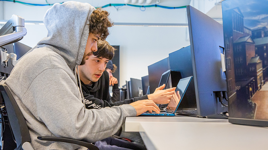 students searching computer together