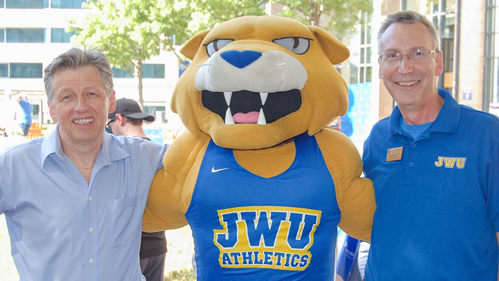 Wildcat Willie poses with Charlotte Campus President Richard Mathieu