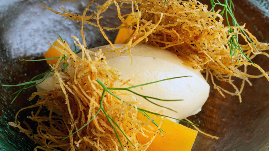 Closeup of sorbet with fennel fronds.