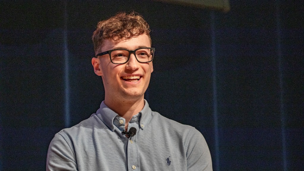 Logan Daubel presenting on stage