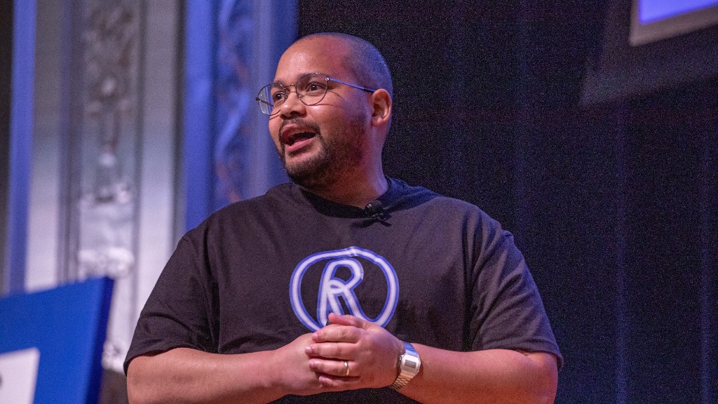 Randy Benitez presenting on stage