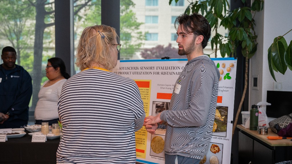 Kyle James Duggan ’25 explaining his concept for creating nutritional food products while reducing food waste. 
