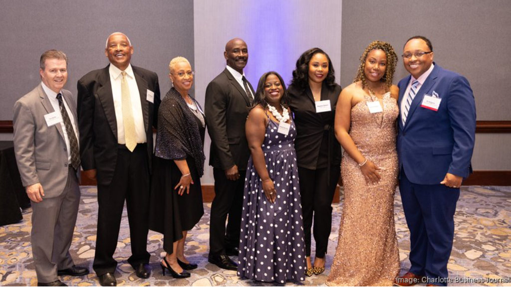 group photo taken at 40 under 40 awards ceremony with RJ Kilgore on far right