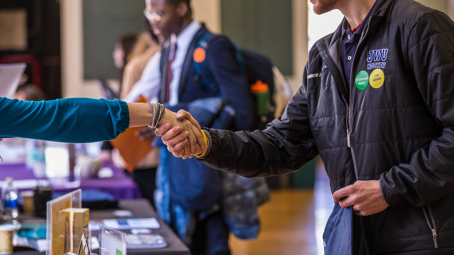 Two people shaking hands.