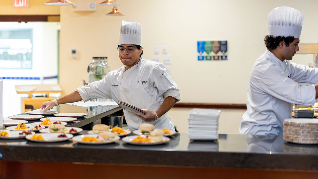 Corporate Dining Concepts students set up the sandwich station for service.