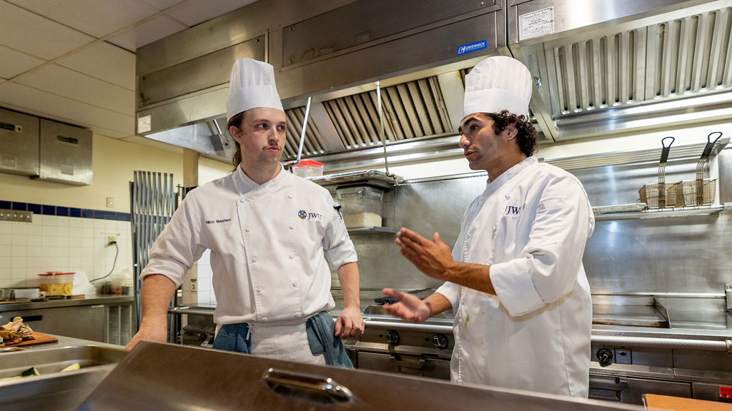 Two Corporate Dining students discuss their plans for service.