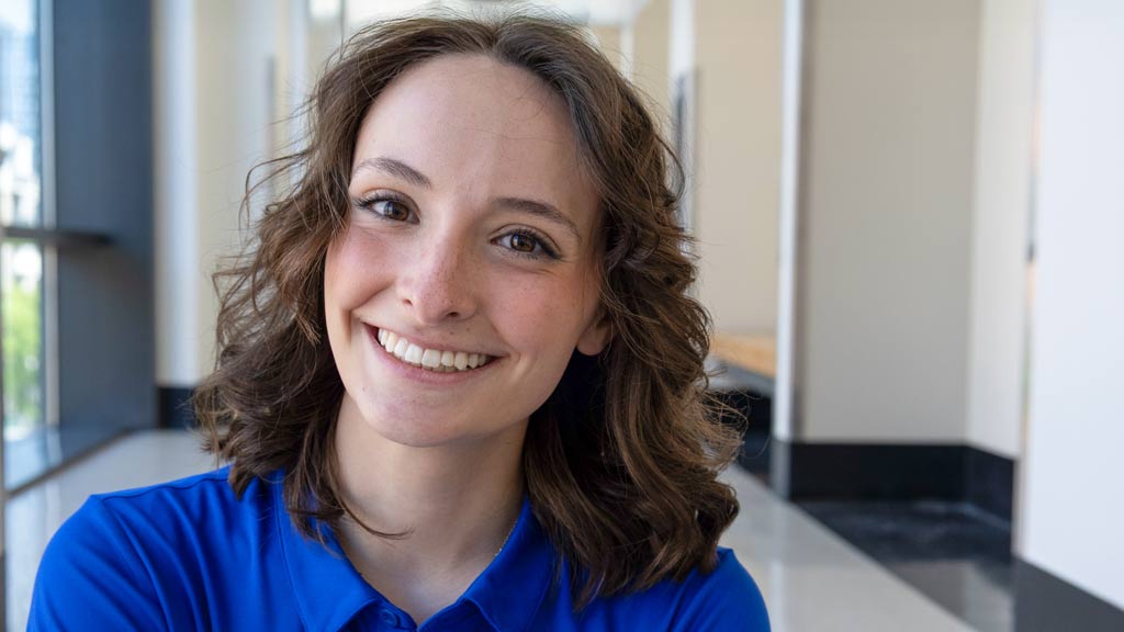 Makenna, a student, smiling at the camera 