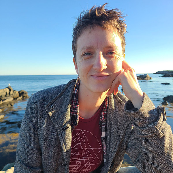 photo of Lenna Wertenbaker '25 B.S.N. outdoors by the ocean