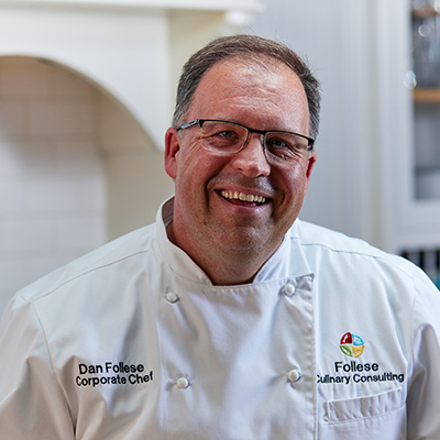 Photo of Dan Follese '94 wearing his chef's whites