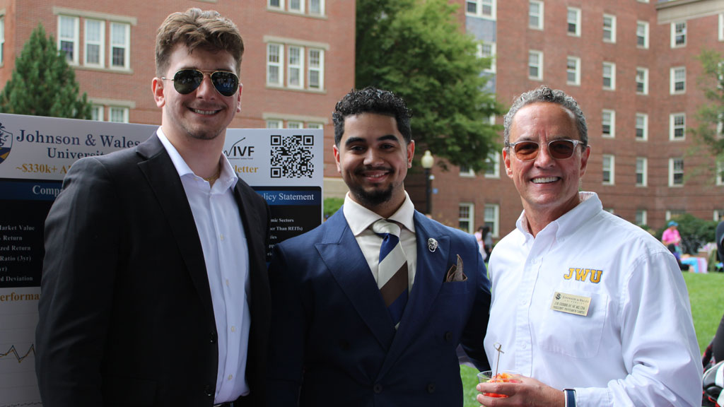 Matthew Regateiro ’25, Anthonellis Morel '25 and Joe Greene ’89, ’98 M.S., CPA, vice chancellor and president of the JWU Providence Campus