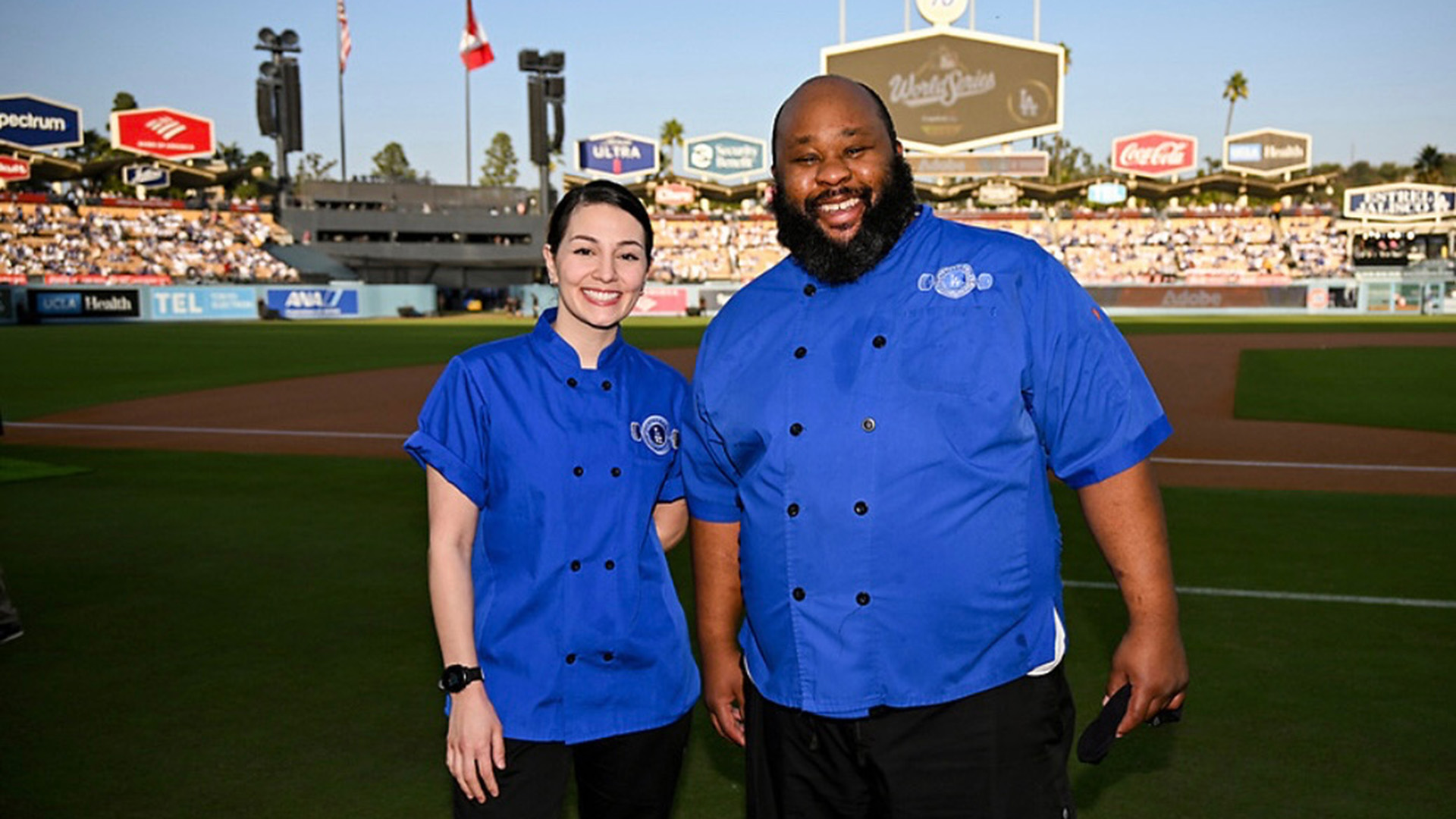 Kristen Loiacono and Tyrone Hall on the field