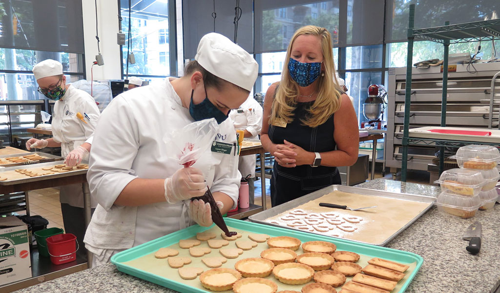 President Richards observing a baking & pastry class at JWU Charlotte.