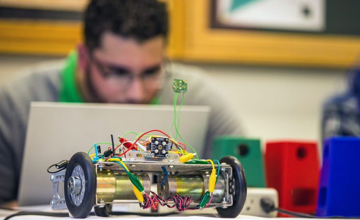 Small robotic controllable car being used in robotics lab 